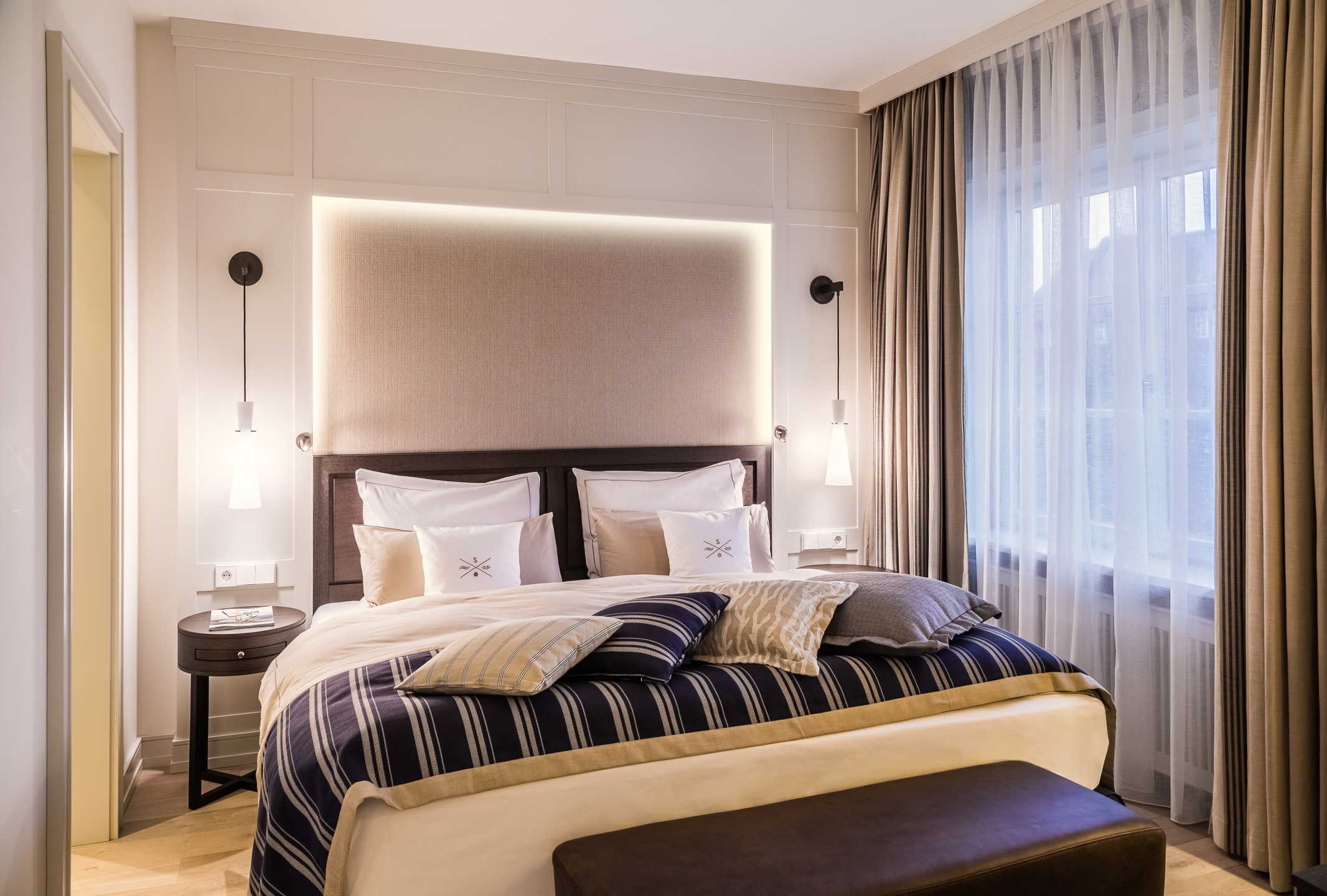 Comfortable bedroom in the Deluxe double room of the hotel of Severin*s on Sylt