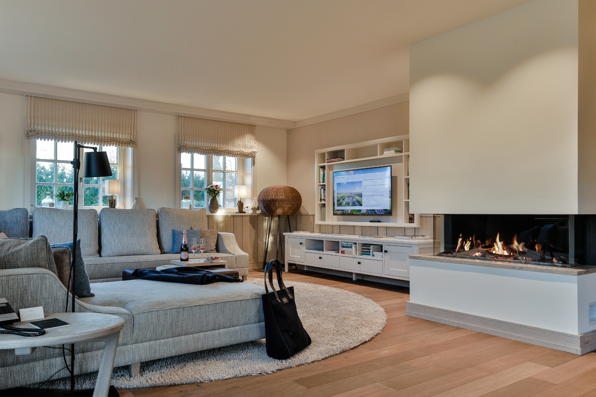 Villa Severin*s Plus living area with fire place, TV & couch hotel Sylt