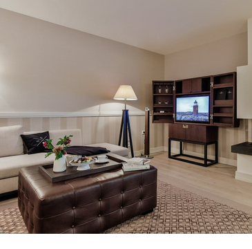 Severin*s Suite living area fire place TV couch 5 star hotel Sylt