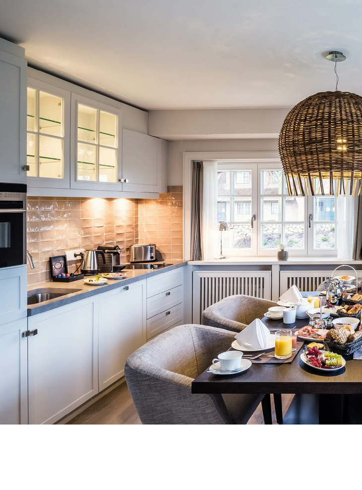 Hotel rooms & suites kitchen with laid table luxus hotel Keitum