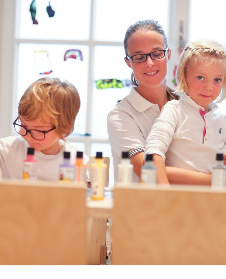 Carer with playing child in the Kids Club of the Hotel Severin*s Resort and Spa on Sylt