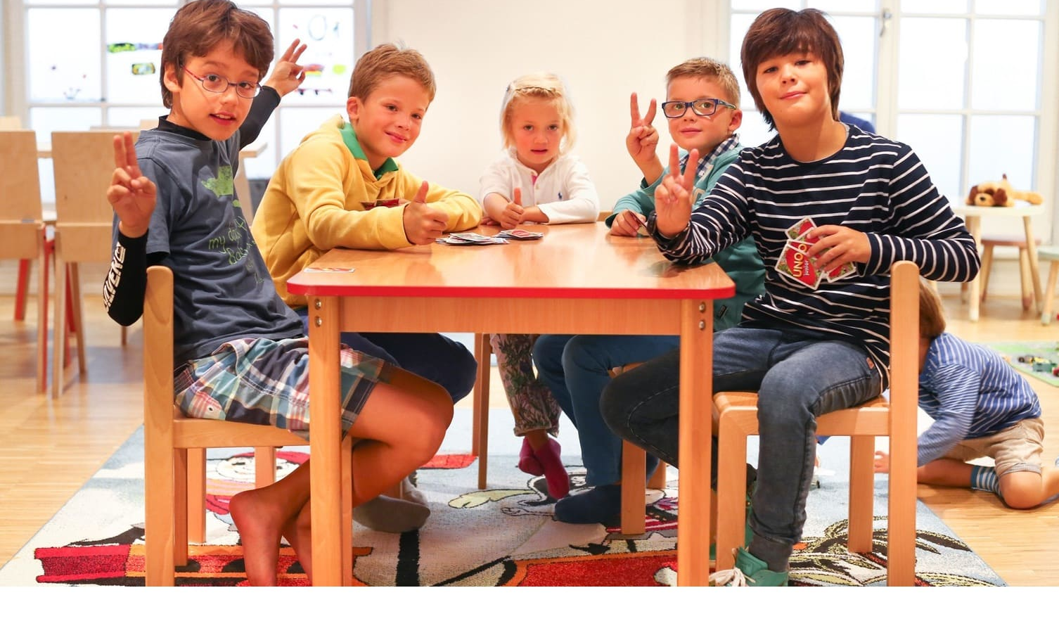 Happy kids at a table at the Kids Club of the Severin*s Hotel Resort and Spa on Sylt