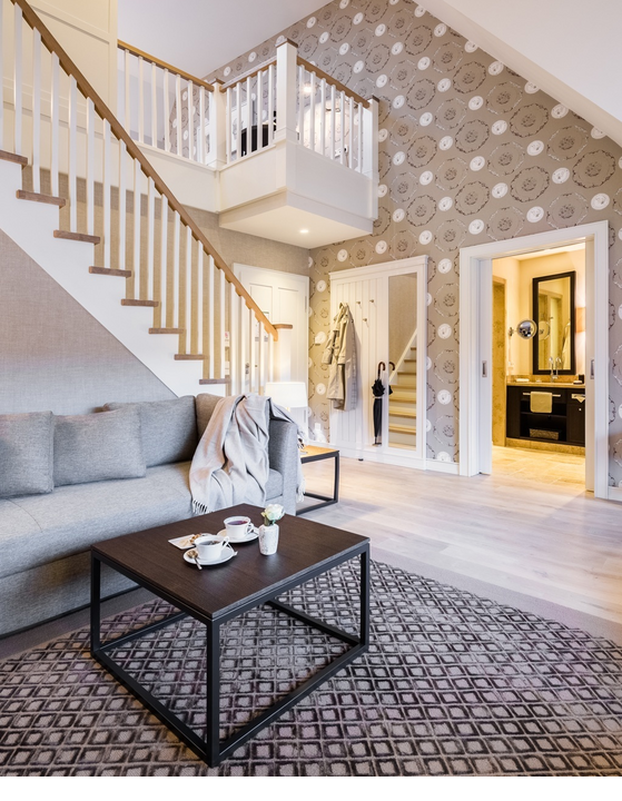 Interior lower floor overlooking staircase in Maisonette Family Senior Suite at Hotel Severin*s Resort and Spa on Sylt