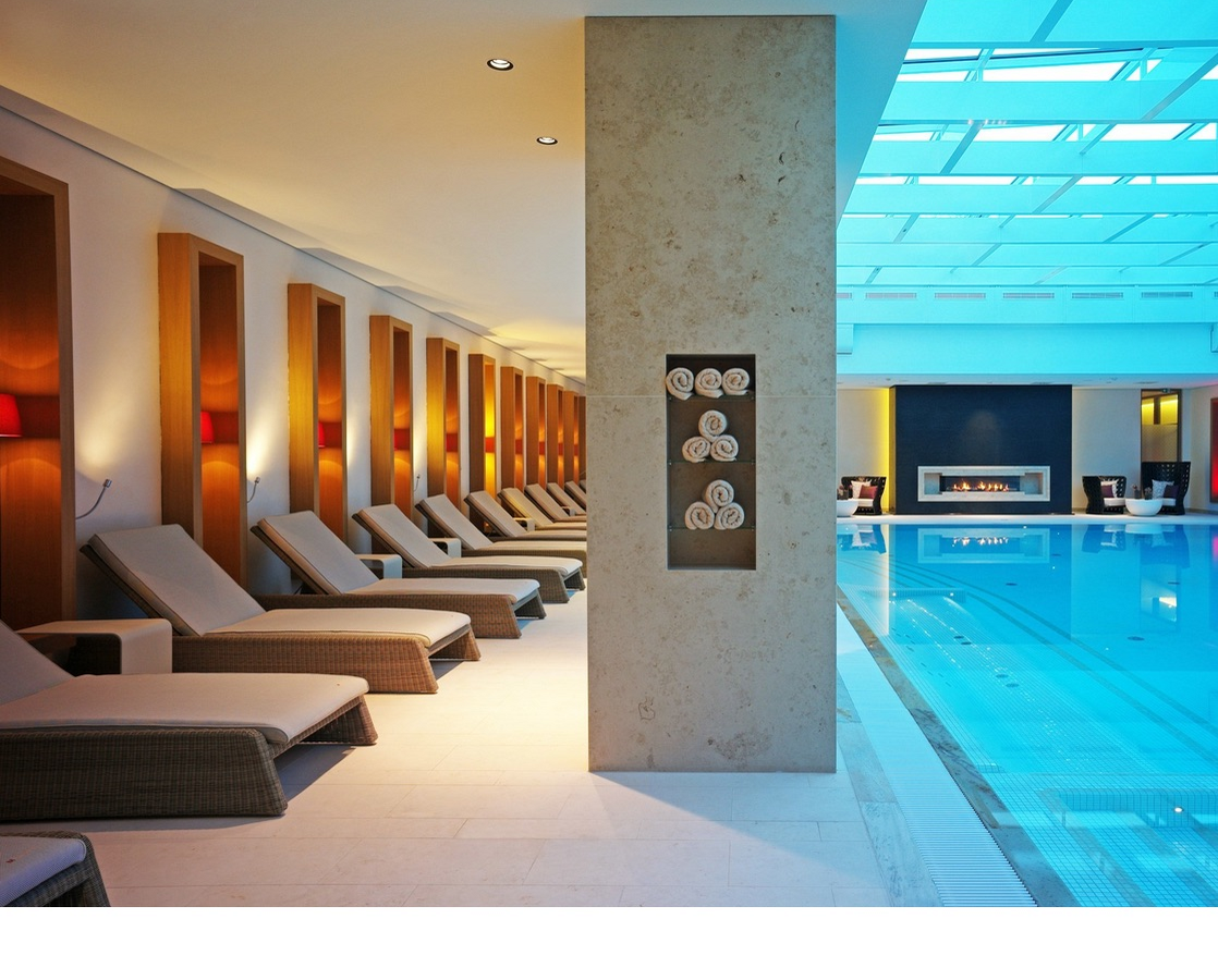 Swimming pool and relaxation area and swimming pool with natural light in the Hotel Severin*s Resort and Spa on Sylt